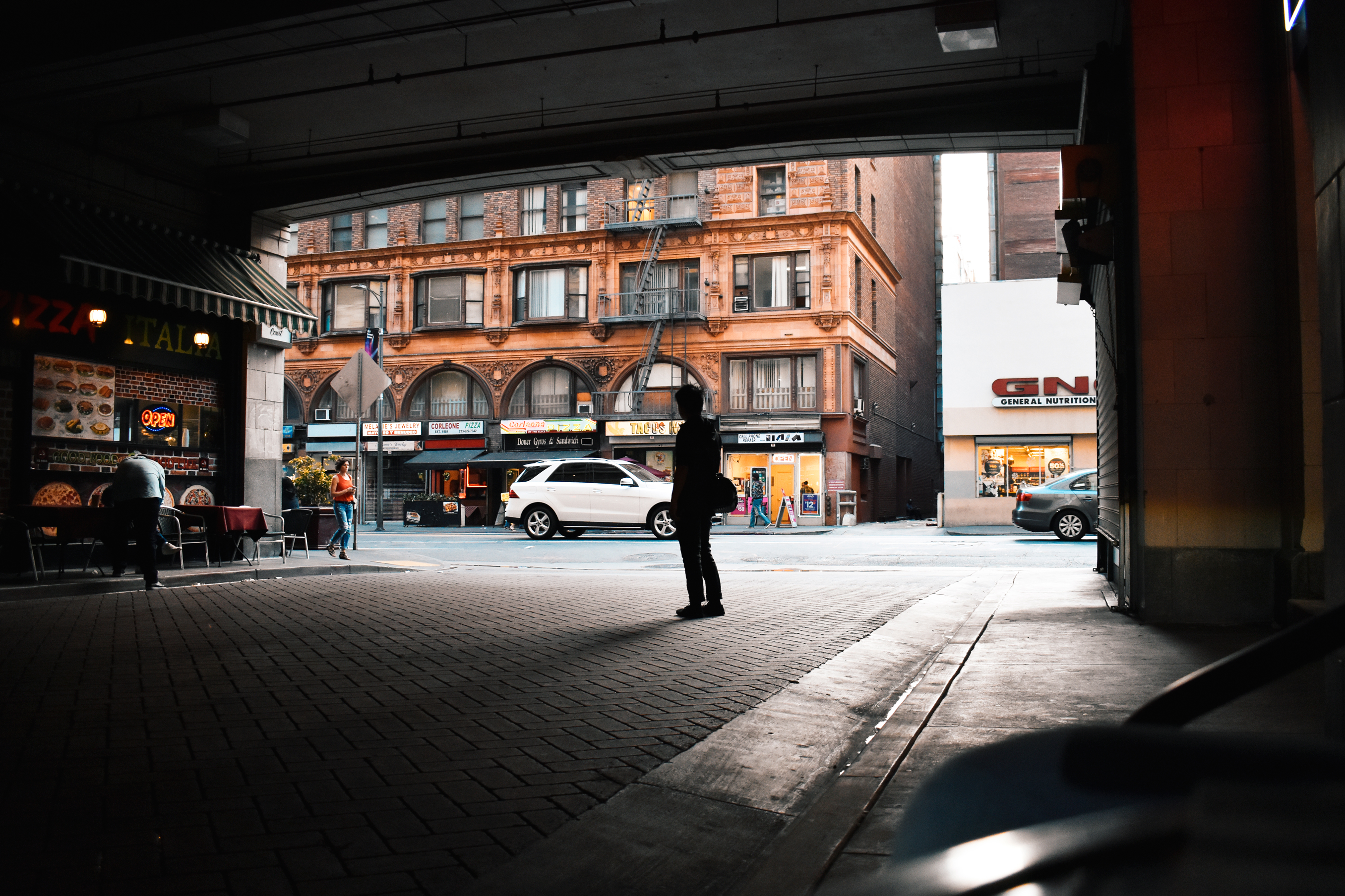 silhouette of a guy in alley